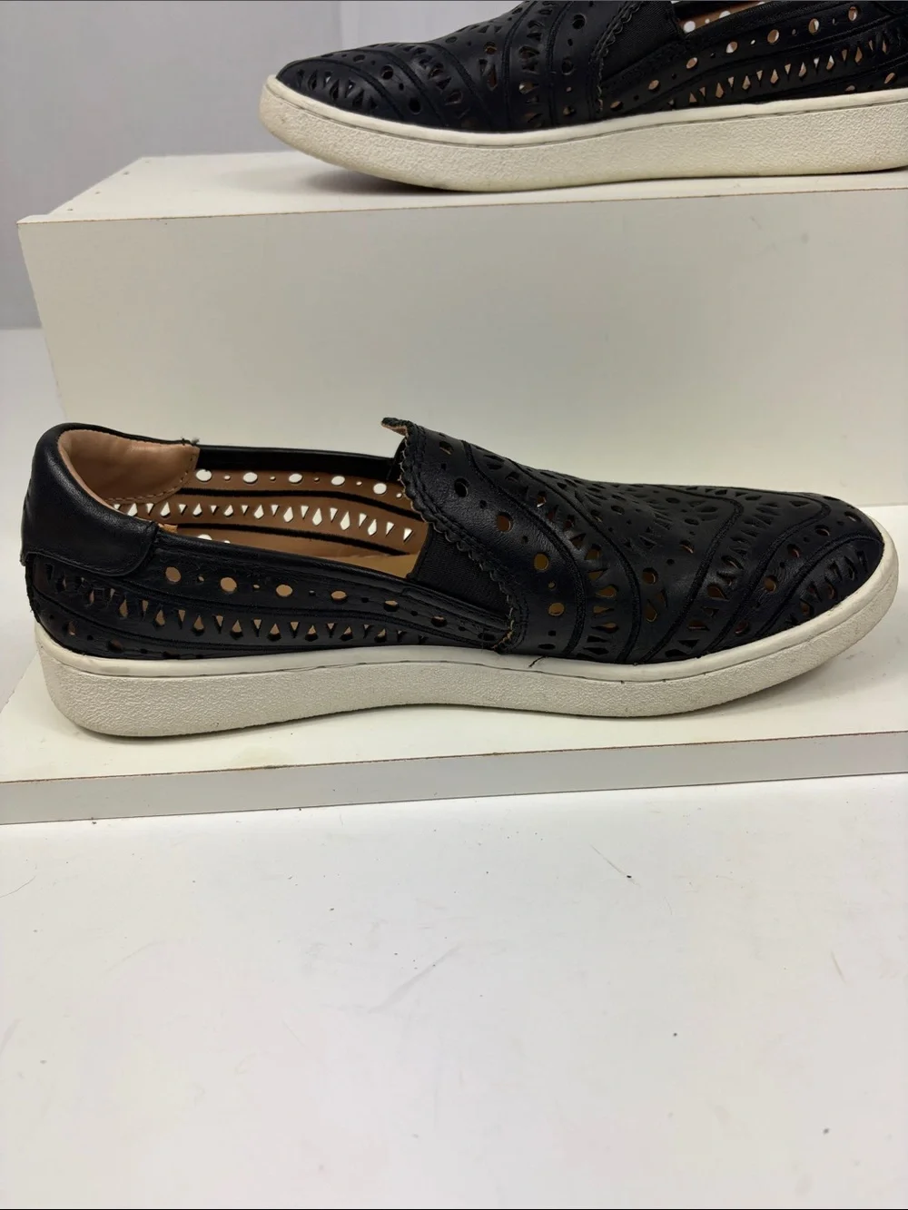 UGG CAS‎ Perforated Slip On Sneaker in Black.